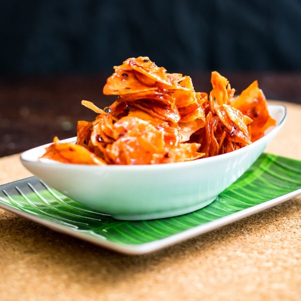 Kerepek Pedas or Crackers made of cassava or tapioca. Sliced, fried and cooked with chilli.